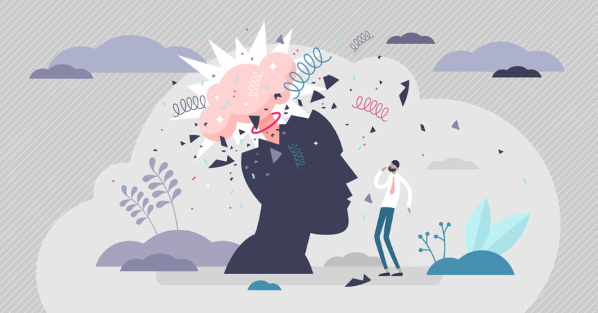 Diagram of a brain with man standing in front of it. The mind appears to explode.