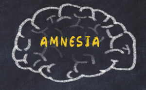 chalk outline drawing of brain with the word amnesia written inside